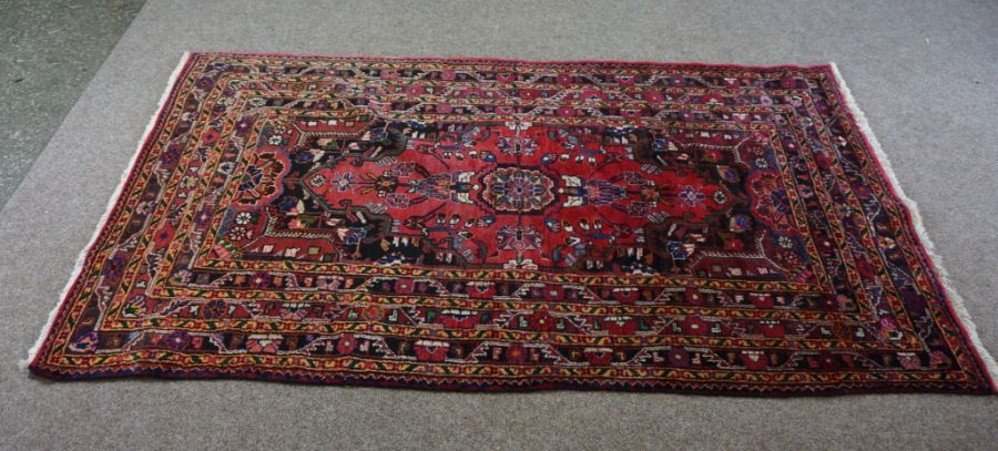 A small Iranian Tuisarkhan rug, modern, 20th century, with single central medallion on a floral blue