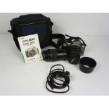 A Canon Eos 300D digital camera, including EFS 18-55mm & EF 55-200 telephoto lenses, in a case