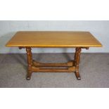 An oak refectory dining table, modern, 20th century, with a rectangular top on two shaped pier