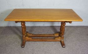 An oak refectory dining table, modern, 20th century, with a rectangular top on two shaped pier