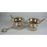 A silver plated George III style double wine coaster carriage, 20th century, each of the two