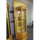 A bespoke birch framed jewellers shop cabinet shop fitting, with three glass shelves, mirrored