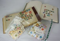 Two boxes of assorted stamp albums, including British and worldwide stamps, also bags of loose