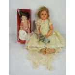 A child's doll, with various clothing, another doll and associated material (a lot)