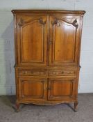 A compact walnut 18th century style armoire, Modern, with two moulded cabinet doors over two small