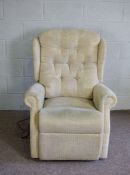 A modern reclining upholstered motorised armchair, fitted for electricity (not tested)