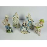 A pair of Dresden china figures, circa 1900, both seated in 18th century dress, 19cm high;