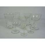 A fine set of Edwardian etched table glasses, including a eight champagne bowls, eight martini