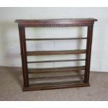 A small oak 19th century style dresser wall rack, with dentil cornice and three shelves, each with a