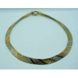 An 18 carat gold Oritalia three coloured gold necklace ribbon scale necklace, the clasp stamped 750,