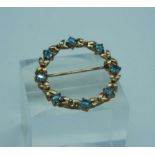 A 9 carat gold and aquamarine brooch, together with an 18 carat plain gold ring, size S (UK), 3g;