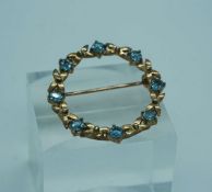 A 9 carat gold and aquamarine brooch, together with an 18 carat plain gold ring, size S (UK), 3g;