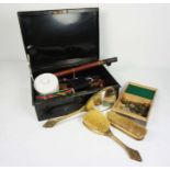A tin box of assorted items including a decorative pewter trinket box, gilt decorated dressing
