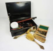 A tin box of assorted items including a decorative pewter trinket box, gilt decorated dressing