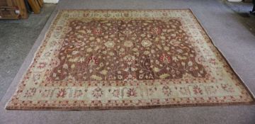 A Pakistan Chobi rug, modern, with flower-heads and arabesques on a brown field, with cream