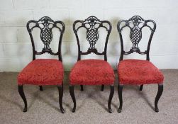 Three Victorian style stained wood salon chairs, with ‘pineapple’ pierced backs and stuffed over