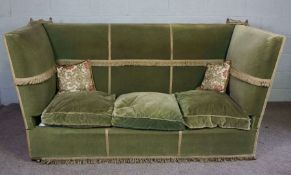 A large traditional Knole Sofa, early 20th century, with high back and sides, tasselled trim,