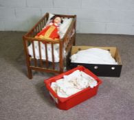 A child’s cot, mid 20th century, with slatted and folding sides, including a small mattress (used as