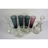 A large assortment of table glass, including four tall smoked glasses, two decanters, brandy glasses