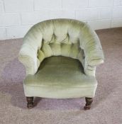 A Victorian button upholstered tub chair, with turned oak feet and castors, 66cm high; together with