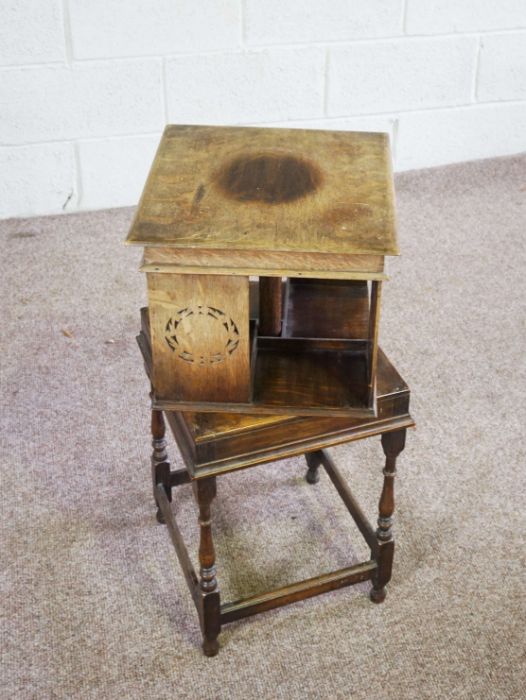 A rotating oak bookstand, circa 1900, with square moulded top, four book compartments with - Image 3 of 4