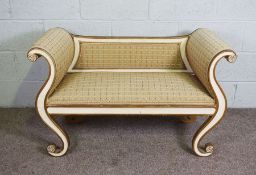 A Regency style ‘Grecian’ window seat, 19th century, with scrolling supports, stuffed sides and