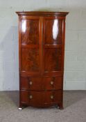 A Georgian style bowfront cabinet, fitted as television cabinet, 169cm high, 89cm wide