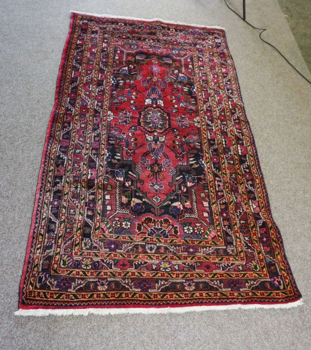 A small Iranian Tuisarkhan rug, modern, 20th century, with single central medallion on a floral blue - Image 2 of 4