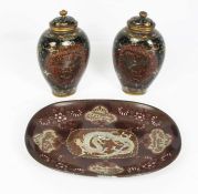 A pair of Chinese Cloissoné vases with covers, Qing Dynasty, each ovoid vase decorated with a