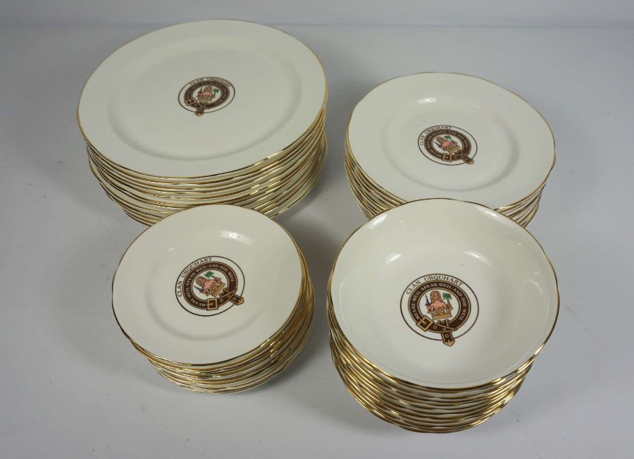 A set of Clan Urquhart crested table china, including 12 bowls, 12 large plates, 12 dessert