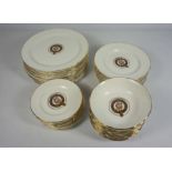 A set of Clan Urquhart crested table china, including 12 bowls, 12 large plates, 12 dessert