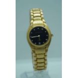An Aston Gerrard gold plated and diamond ladies watch, the black face set with diamond markers and