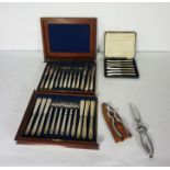 A cased set of six silver butter knives (loaded), together with a cased set of plated fish eaters, a