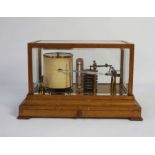 An oak cased barograph, unsigned, 21cm high, 21cm deep, 35cm long