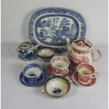 A quantity of blue and red transfer printed tea wares, including Booth’s ‘Old Real Willow’