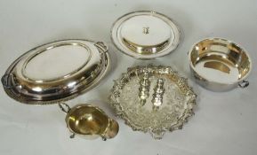 An Edwardian silver waiter, hallmarked London 1905, T.B, of typical form with stiff leaf border