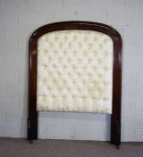 A large arched mahogany and button upholstered bedhead, with moulded frame (bedhead only), 187cm