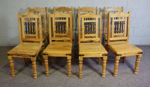 A set of eight Continental dining chairs, probably olive wood, Modern, each with inset ‘ironwork’