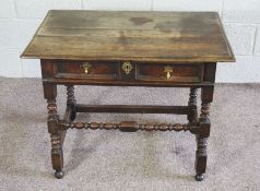 A Charles II oak side table, late 17th century, with a rectangular moulded plain top, set over a