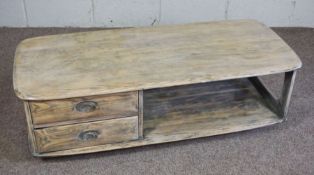A large vintage 'Minerva' coffee table by Ercol furniture company, solid elm construction with two