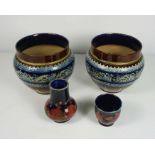 A pair of Doulton Lambeth glazed stoneware jardiniere, impressed with a border of blue flowers and