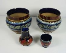 A pair of Doulton Lambeth glazed stoneware jardiniere, impressed with a border of blue flowers and