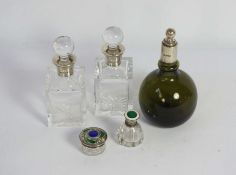 An Edwardian silver topped and green glass perfume bottle, hallmarked Sheffield 1914, of globular