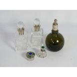 An Edwardian silver topped and green glass perfume bottle, hallmarked Sheffield 1914, of globular