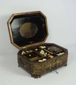 A Chinese Export lacquered sewing box, circa 1880, Qing Dynasty, of octagonal form, with a hinged