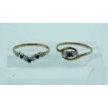 A 9 carat gold engagement ring and matching eternity ring, in white and black cubic zirconia, hooped