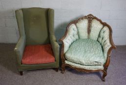 A Victorian varnished oak and button upholstered salon armchair, with a deep seat, carved and