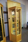 A bespoke birch framed jewellers shop cabinet shop fitting, with three glass shelves, mirrored