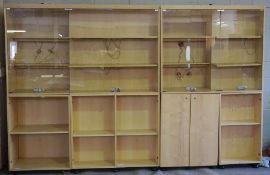 A large modern jewellery shop display cabinet, in sections, with a glazed top and lockable cabinets,