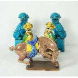 A pair of modern Chinese turquoise porcelain figures of lions, 30cm high; another polychrome pair,